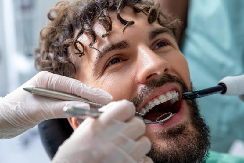 Woman with braces smiling