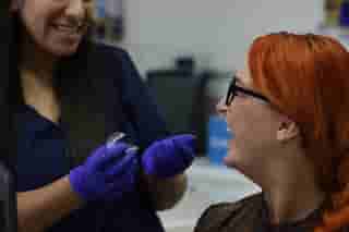 An orthodontist and patient discuss clear aligners