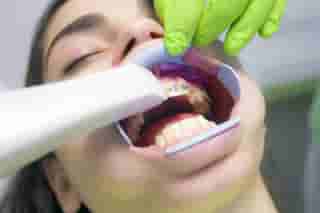 A fixed metal brace is applied to teenage patient